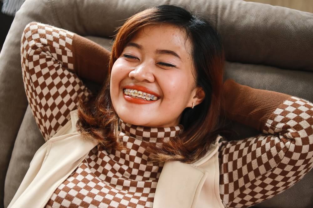 Enjoying Asian Adult Woman Wear Braces