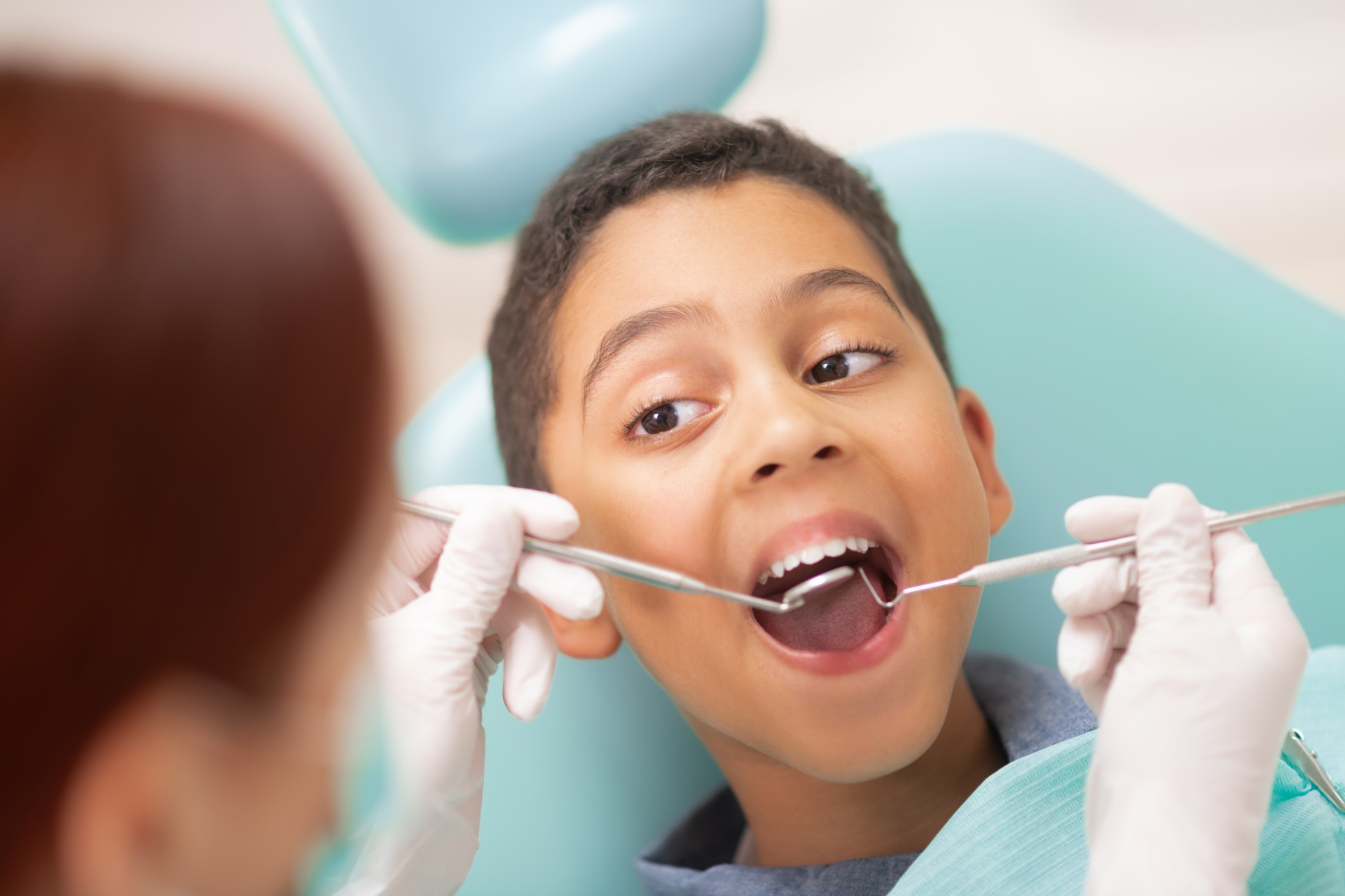 young kid having dental fillings